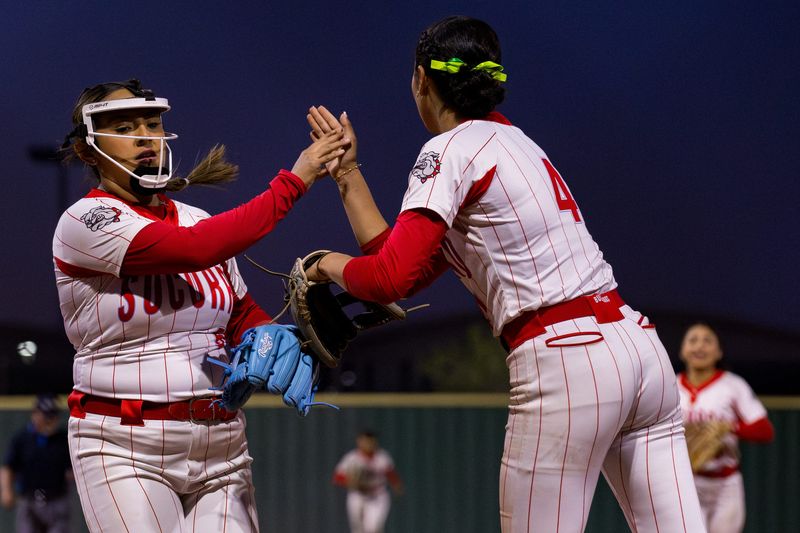Socorro’s Haley Rodriguez (5) and Danielle Lozoya (4) high five during a District 1-6A game against Socorro at Eastlake High School on Tuesday, March 17, 2026, in El Paso, Texas.