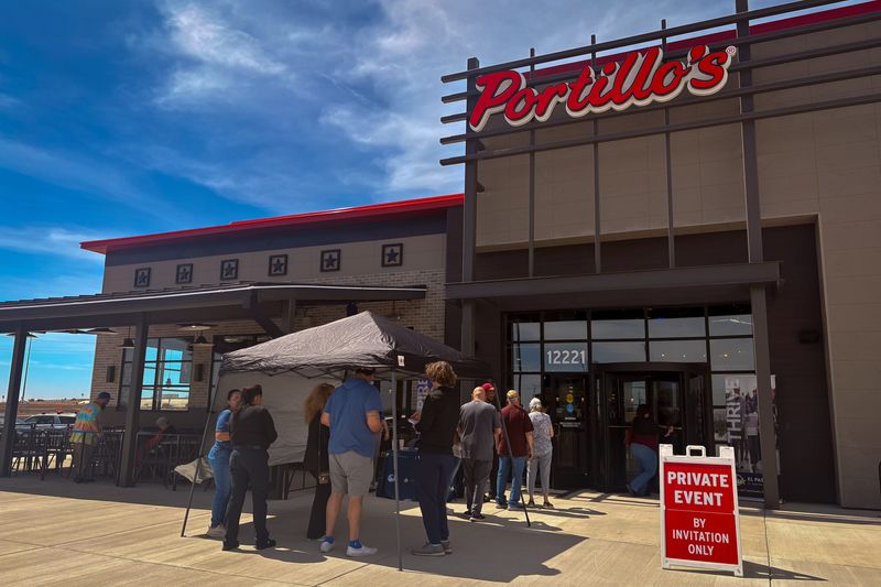 People line up outside Portillo’s during the restaurant’s soft opening Wednesday, March 18, 2026, at 12221 Montana Ave. in El Paso, Texas.