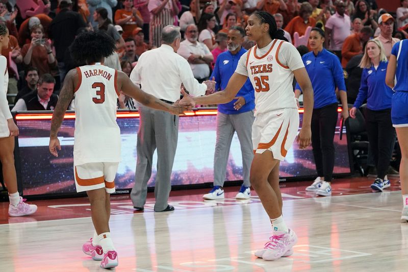 Feb 9, 2026; Austin, Texas, USA; Texas Longhorns forward Madison Booker (35) and guard Rori Harmon (3) celebrate a 64-53 win against the Kentucky Wildcats after the game at Moody Center. Mandatory Credit: Dustin Safranek-Imagn Images