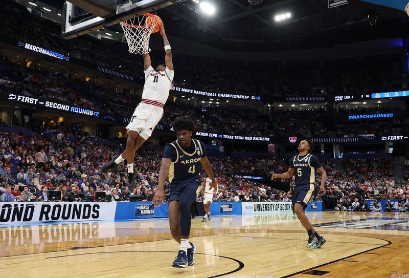 Mar 20, 2026; Tampa, FL, USA; Texas Tech Red Raiders guard Jaylen Petty (11) shoots against Akron Zips guard Eric Mahaffey (4) in the second half during a first round game of the men's 2026 NCAA Tournament at Benchmark International Arena. Mandatory Credit: Nathan Ray Seebeck-Imagn Images