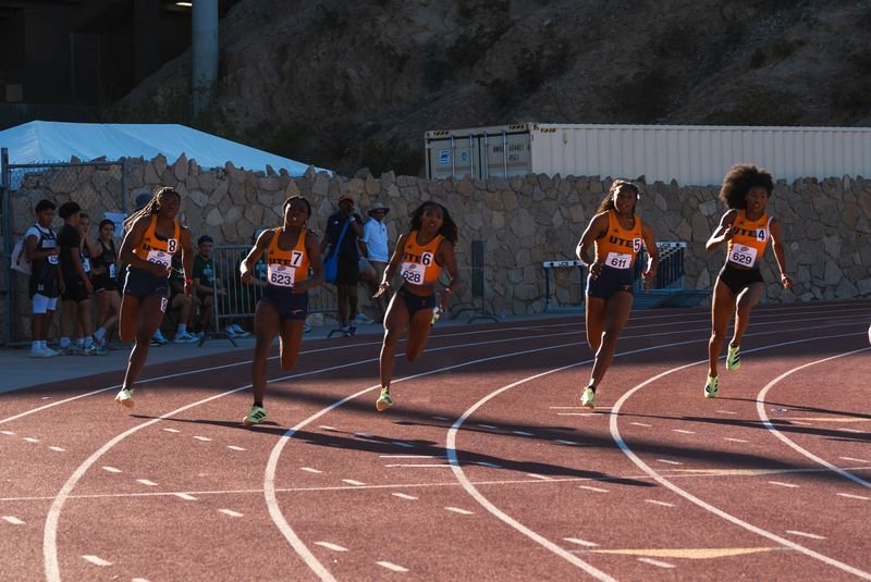 Cydni Martin, second from left in No. 7, leads a UTEP contingent in the 200 meters Friday at Kidd Field. Martin won the race in 23.48 seconds.