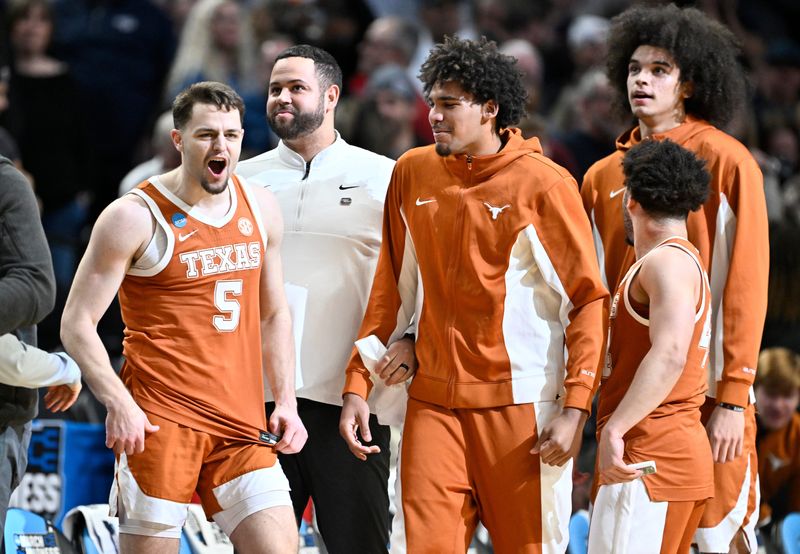 Mar 21, 2026; Portland, OR, USA; Texas Longhorns forward Camden Heide (5) celebrates with teammates after defeating the Gonzaga Bulldogs during a second round game of the men's 2026 NCAA Tournament at Moda Center. Mandatory Credit: Craig Strobeck-Imagn Images