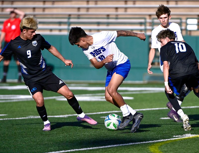 Lakeview’s Giovanni Mendoza (center) tries to get past Decatur’s Adrian Sanchez (left) and Richie Rodriguez during the Class 4A DI soccer playoff at Shotwell Stadium in Abilene Tuesday March 24, 2026. Final score was 3-2, Decatur.