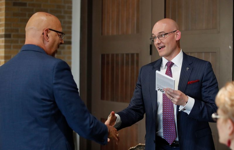 Alexander William Salter gave a lecture and held a book signing as part of the FMI Public Speaker Series, The Spirit of 76 Libertarianism & American Renewal, held in the Frazier Alumni Pavilion Tuesday, March 24, 2025. Mayor Mark McBrayer shakes hands with Salter during the book signing.