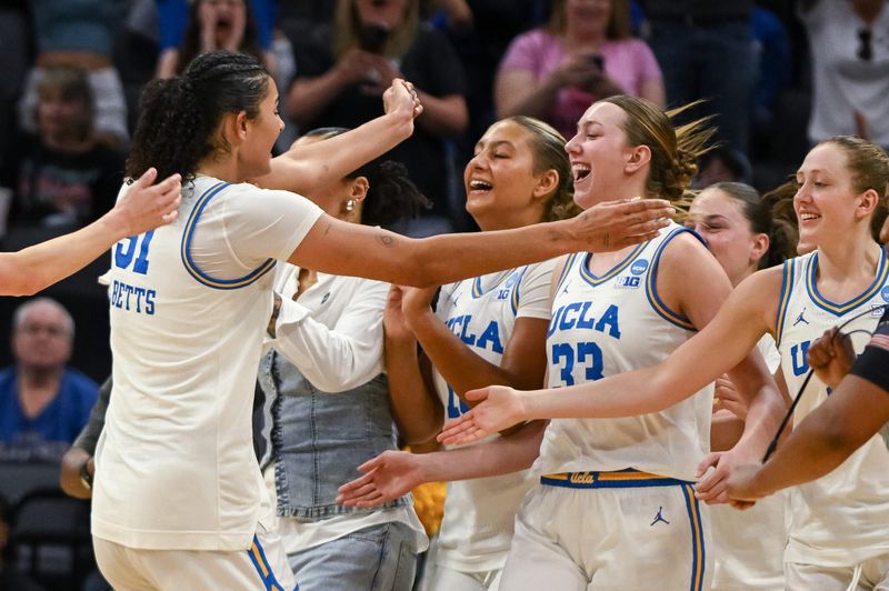 Mar 29, 2026; Sacramento, CA, USA; UCLA Bruins center Lauren Betts (51) celebrates with forward Angela Dugalić (32) after defeating the Duke Blue Devils in an Elite Eight game in the Sacramento Regional 4 of the women's 2026 NCAA Tournament at the Golden 1 Center. Mandatory Credit: Ed Szczepanski-Imagn Images