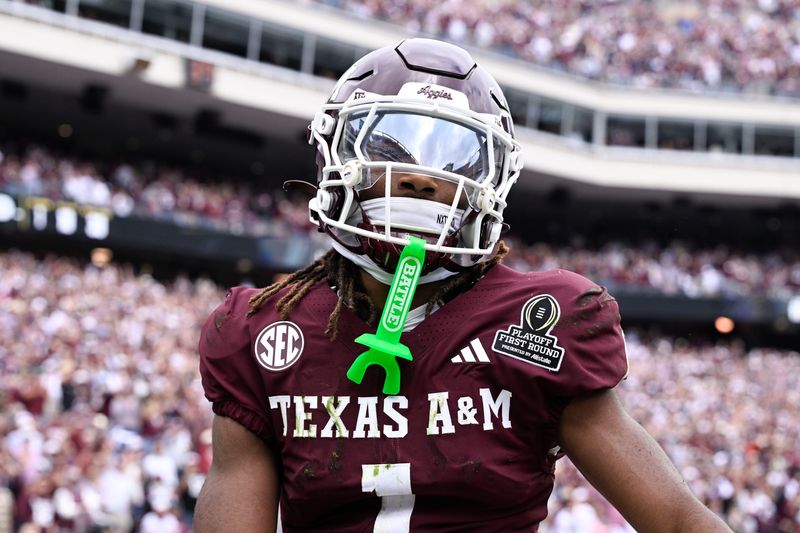 Dec 20, 2025; College Station, TX, USA; Texas A&M Aggies wide receiver Mario Craver (1) celebrates a catch against the Texas A&M Aggies during first half of the first round game of the CFP National Playoff at Kyle Field. Mandatory Credit: Jerome Miron-Imagn Images