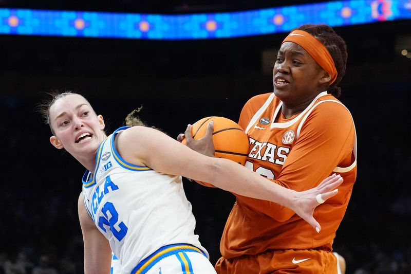 Apr 3, 2026; Phoenix, AZ, USA; Texas Longhorns center Kyla Oldacre (00) collides with UCLA Bruins forward Angela Dugalic (32) during the first half of a semifinal of the Final Four of the women's 2026 NCAA Tournament at Mortgage Matchup Center. Mandatory Credit: Kirby Lee-Imagn Images