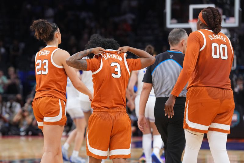 Apr 3, 2026; Phoenix, AZ, USA; Texas Longhorns guard Aaliyah Crump (23), guard Rori Harmon (3), and center Kyla Oldacre (00) react during the second half of a semifinal of the Final Four of the women's 2026 NCAA Tournament against the UCLA Bruins at Mortgage Matchup Center. Mandatory Credit: Joe Camporeale-Imagn Images