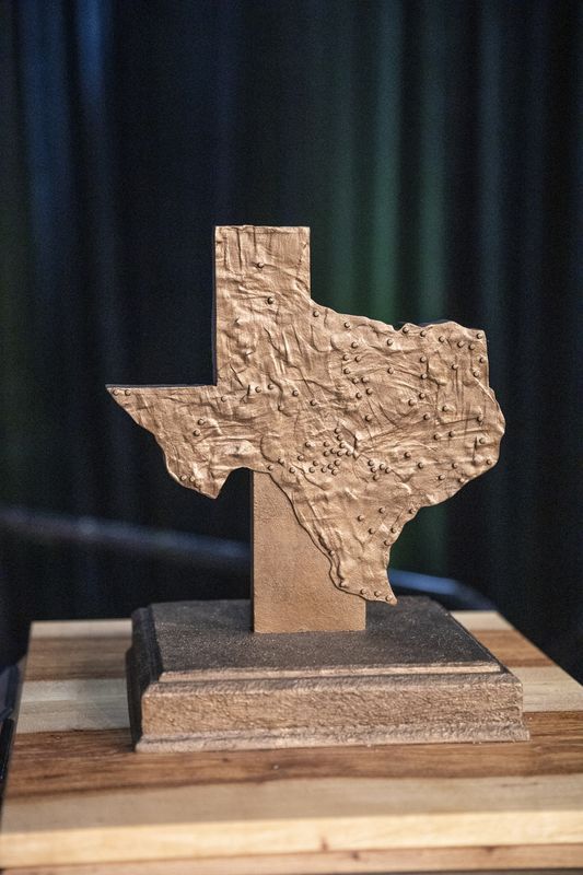 Atop the Texas Centennial Time Capsule, visiting Palo Duro Canyon, is a map of state parks it will be visiting and staying for six months.