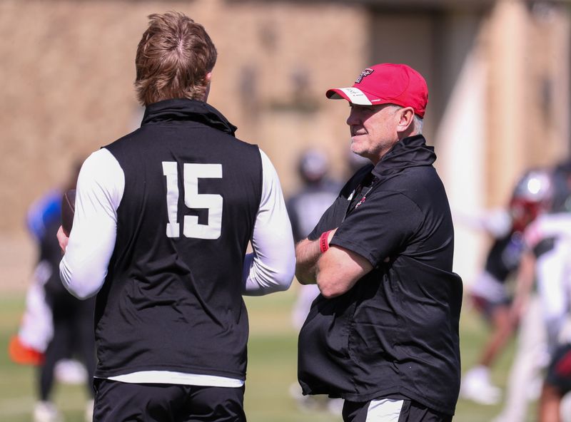 Texas Tech head coach Joey McGuire talks to Will Hammond during spring football practice, Thursday, April 9, 2026, at the Womble Football Center.