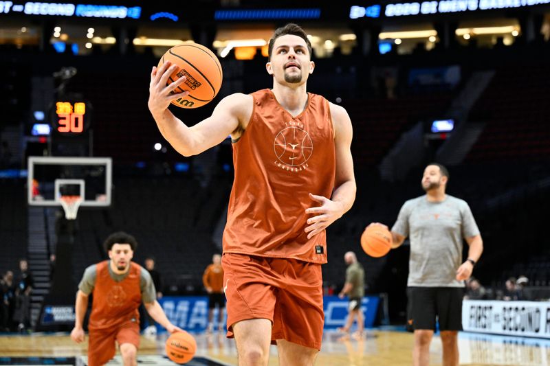 Mar 18, 2026; Portland, OR, USA; Texas Longhorns forward Camden Heide (5) participates in a drill during a practice session ahead of the first round of the men's 2026 NCAA Tournament at Moda Center. Mandatory Credit: Craig Strobeck-Imagn Images