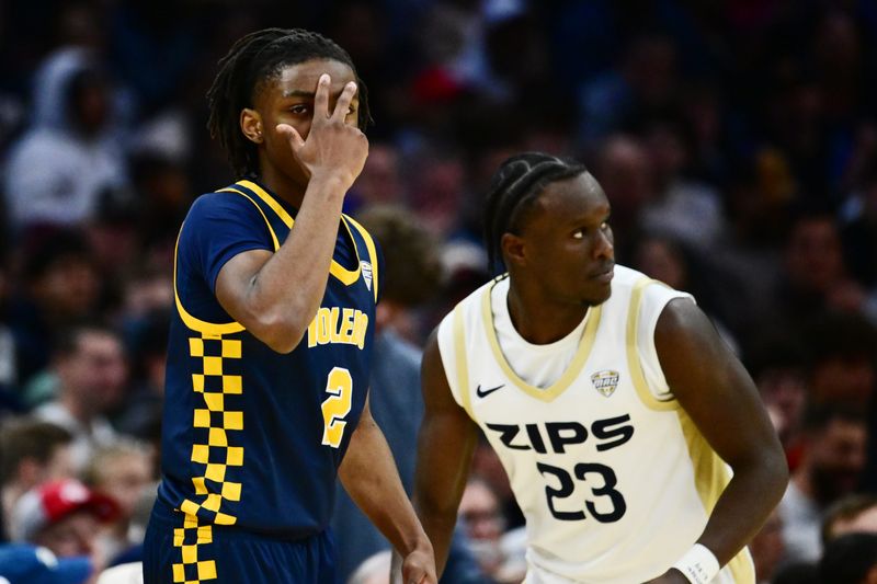 Mar 14, 2026; Cleveland, OH, USA; Toledo Rockets guard Leroy Blyden Jr. (2) celebrates after hitting a three point basket against the Akron Zips during the first half of the men’s Mid-American Conference Championship at Rocket Arena. Mandatory Credit: Ken Blaze-Imagn Images