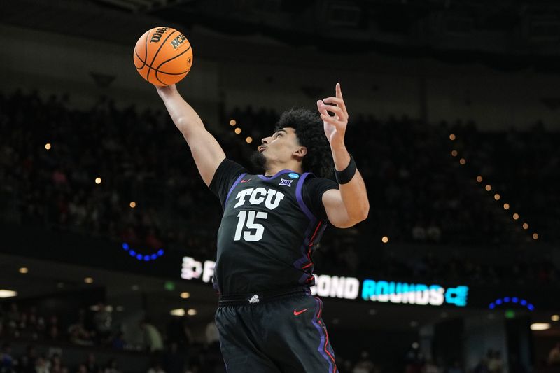 Mar 19, 2026; Greenville, SC, USA; Texas Christian University Horned Frogs forward David Punch (15) grabs a rebound against the Ohio State Buckeyes in the second half during a first round game of the men's 2026 NCAA Tournament at Bon Secours Wellness Arena. Mandatory Credit: Bob Donnan-Imagn Images