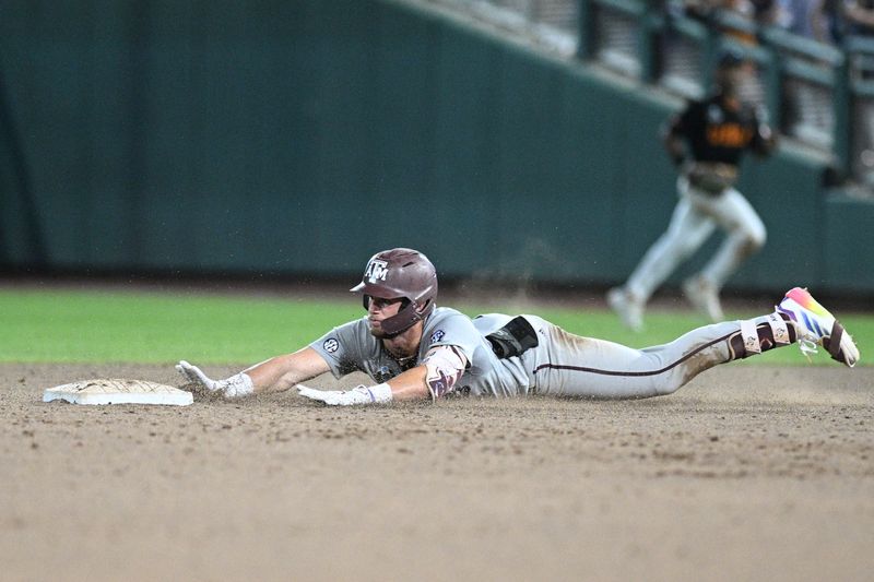 Jun 24, 2024; Omaha, NE, USA; Texas A&M Aggies third baseman Gavin Grahovac (9) slides into second base with a double to lead off against the Tennessee Volunteers during the ninth inning at Charles Schwab Field Omaha. Mandatory Credit: Steven Branscombe-USA TODAY Sports