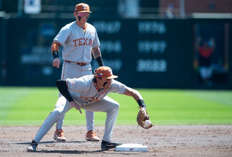 Texas Longhorns' Adrian Rodriguez (24) fields a ground ball as Auburn Tigers take on Texas Longhorns at Plainsman Park in Auburn, Ala. on Sunday, March 22, 2026.