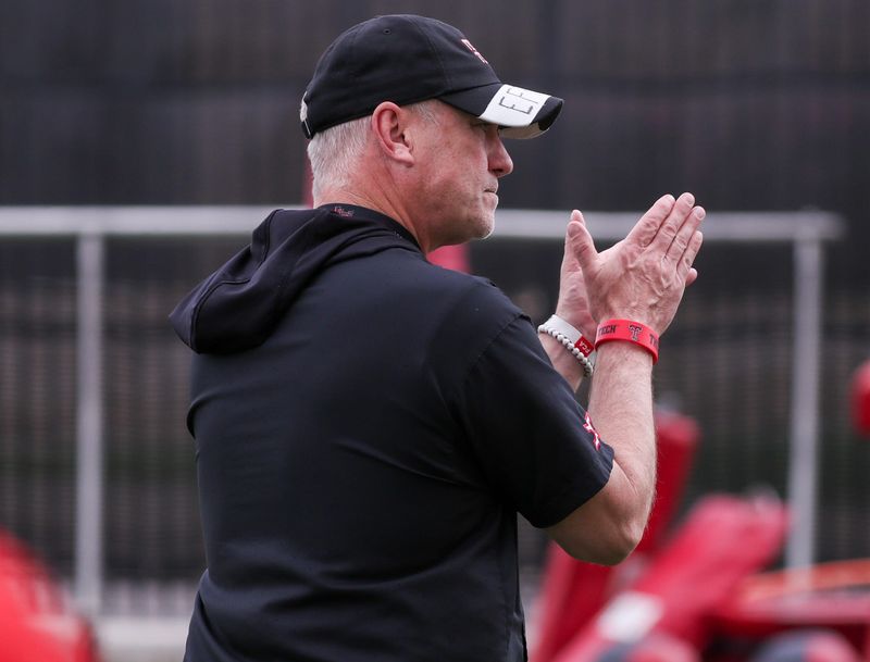 Texas Tech head coach Joey McGuire walks the field during spring football practice, Tuesday, April 14, 2026, at the Womble Football Center.