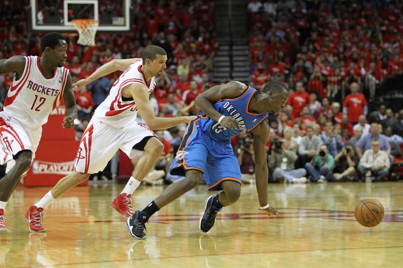 Apr 29, 2013; Houston, TX, USA; Oklahoma City Thunder point guard Reggie Jackson (15) and Houston Rockets shooting guard Francisco Garcia (32) and point guard Patrick Beverley (12) chase a loose ball in the fourth quarter in game four of the first round of the 2013 NBA playoffs at the Toyota Center. The Rockets defeated the Thunder 105-103. Mandatory Credit: Brett Davis-USA TODAY Sports