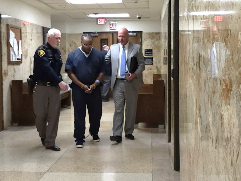 Anthony Washington is escorted April 14, 2026, out of the 137th District Court where he was sentenced to 40 years in prison in exchange for a guilty plea to two counts of manslaughter on the March 27, 2024 deaths of 18-year-old Naomi Harry and 20-year-old Blake Garza.