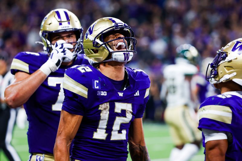 Aug 30, 2025; Seattle, Washington, USA; Washington Huskies wide receiver Denzel Boston (12) celebrates after catching a touchdown pass against the Colorado State Rams during the third quarter at Husky Stadium. Mandatory Credit: Joe Nicholson-Imagn Images
