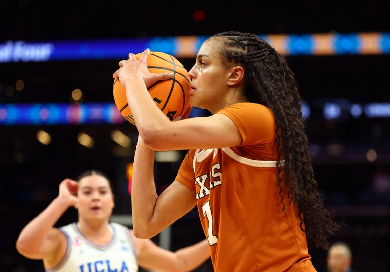 Apr 3, 2026; Phoenix, AZ, USA; Texas Longhorns guard Jordan Lee (7) against the UCLA Bruins during a semifinal of the Final Four of the women's 2026 NCAA Tournament at Mortgage Matchup Center. Mandatory Credit: Mark J. Rebilas-Imagn Images