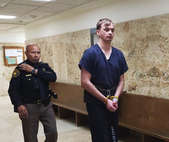 Bode Arnold is escorted out of the 364th District Court after an April 16, 2026, hearing on his request to reduce his $100,000 bond, which was set after his arrest in connection with a March 28, 2026, crash that killed 72-year-old Leo Schneider South of Lubbock.