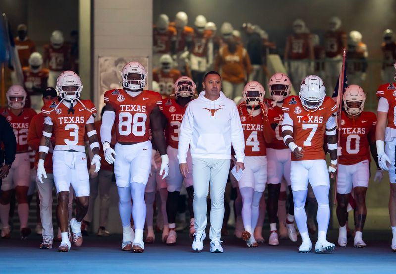 Dec 21, 2024; Austin, Texas, USA; Texas Longhorns head coach Steve Sarkisian leads his team onto the field prior to the game against the Clemson Tigers during the CFP National playoff first round at Darrell K Royal-Texas Memorial Stadium. Mandatory Credit: Mark J. Rebilas-Imagn Images