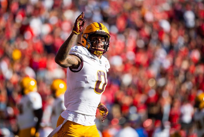 Nov 30, 2024; Tucson, Arizona, USA; Arizona State Sun Devils wide receiver Jordyn Tyson (0) celebrates a touchdown against the Arizona Wildcats in the first half during the Territorial Cup at Arizona Stadium. Mandatory Credit: Mark J. Rebilas-Imagn Images