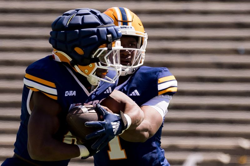 UTEP's EJ Colson hands the ball to Elijah McCoy during the UTEP Spring Game at the Sun Bowl in El Paso on Saturday, April 18, 2026.