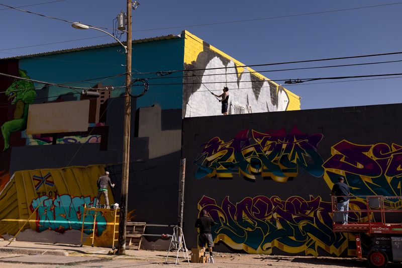 Artists work on multiple murals at different heights during the second day of Borderland Jam on Saturday, April 18, 2026, in Segundo Barrio in El Paso, Texas.