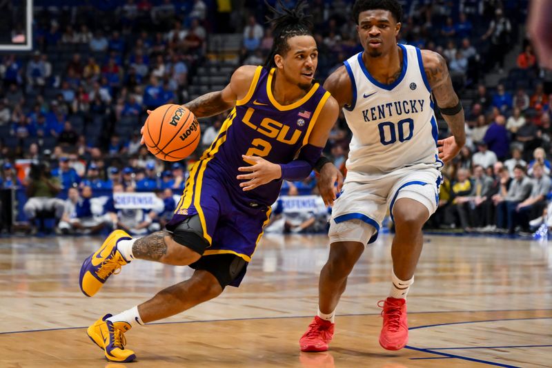 Mar 11, 2026; Nashville, TN, USA; Louisiana State Tigers guard Jalen Reece (2) dribbles past Kentucky Wildcats guard Otega Oweh (00) during the second half at Bridgestone Arena. Mandatory Credit: Steve Roberts-Imagn Images