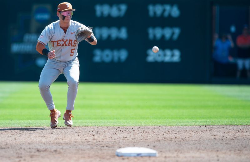 Texas Longhorns' Ethan Mendoza (5) fields a ground ball as Auburn Tigers take on Texas Longhorns at Plainsman Park in Auburn, Ala. on Sunday, March 22, 2026.