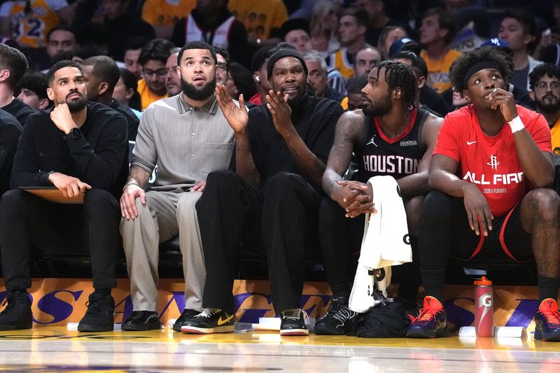 Apr 18, 2026; Los Angeles, California, USA; Houston Rockets guard Fred Vanvleet and forward Kevin Durant watch from the bench against the Los Angeles Lakers in the first half during game one of the first round of the 2026 NBA Playoffs at Crypto.com Arena. Mandatory Credit: Kirby Lee-Imagn Images