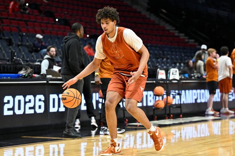 Mar 18, 2026; Portland, OR, USA; Texas Longhorns forward John Clark (9) dribbles the ball during a practice session ahead of the first round of the men's 2026 NCAA Tournament at Moda Center. Mandatory Credit: Craig Strobeck-Imagn Images