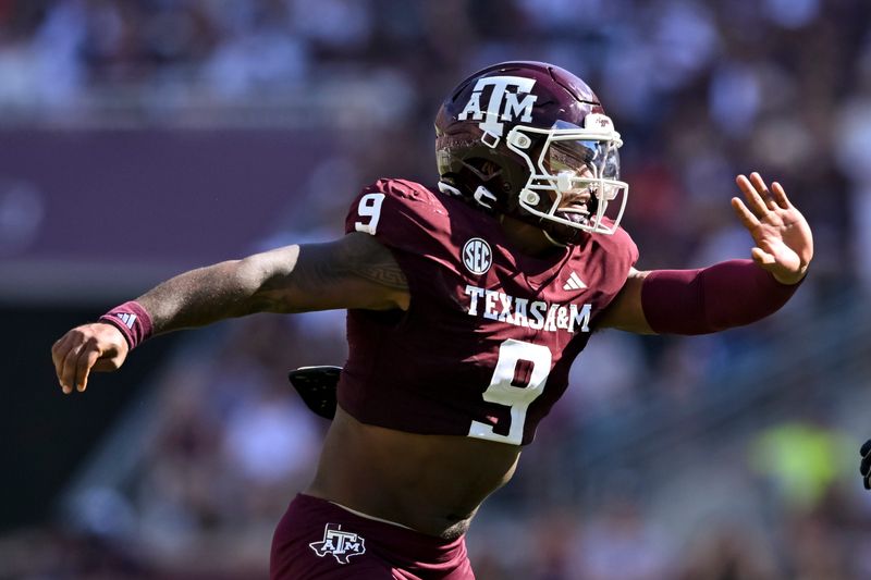 Sep 27, 2025; College Station, Texas, USA; Texas A&M Aggies defensive end Cashius Howell (9) defends in coverage against the Auburn Tigers during the first half at Kyle Field. Mandatory Credit: Maria Lysaker-Imagn Images