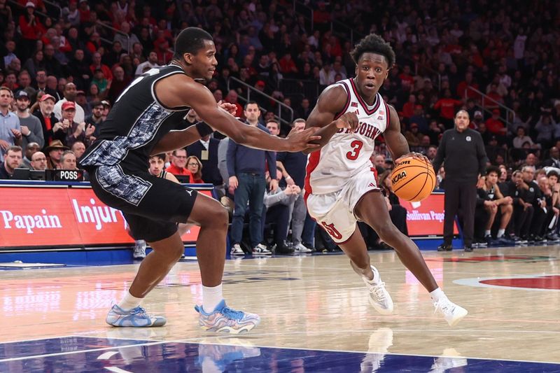 Mar 3, 2026; New York, New York, USA; St. John's Red Storm guard Joson Sanon (3) drives past Georgetown Hoyas center Vincent Iwuchukwu (3) in the second half at Madison Square Garden. Mandatory Credit: Wendell Cruz-Imagn Images