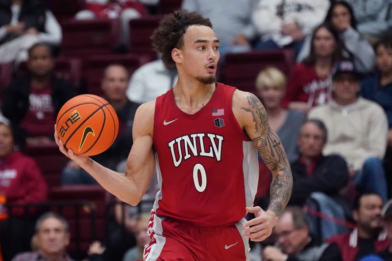 Dec 7, 2025; Stanford, California, USA; UNLV Runnin' Rebels guard Dra Gibbs-Lawhorn (0) dribbles upcourt against the Stanford Cardinal in the second half at Maples Pavilion. Mandatory Credit: David Gonzales-Imagn Images