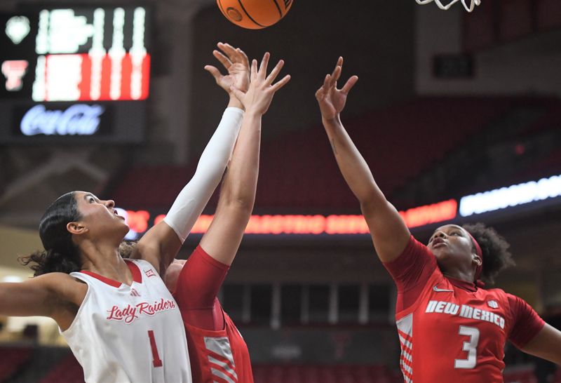 Texas Tech's Jalynn Bristow (1) and New Mexico's Destinee Hooks (3) go after a rebound in a non-conference women's basketball game Tuesday, Nov. 12, 2024, at United Supermarkets Arena.