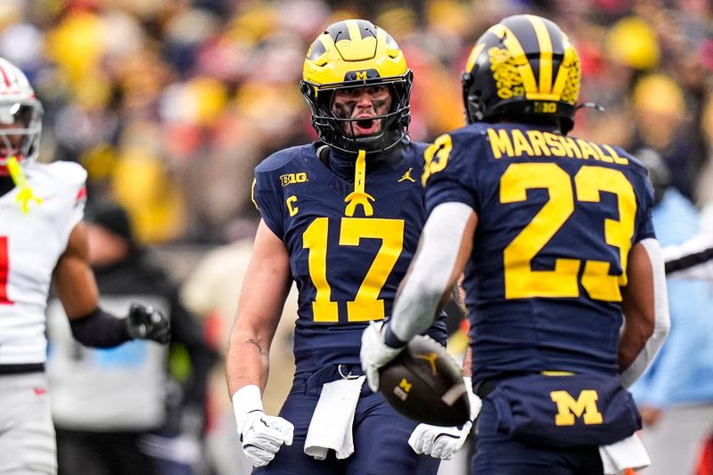 Michigan tight end Marlin Klein (17) celebrates a play made by running back Jordan Marshall (23) against Ohio State during the first half at Michigan Stadium in Ann Arbor on Saturday, Nov. 29, 2025.