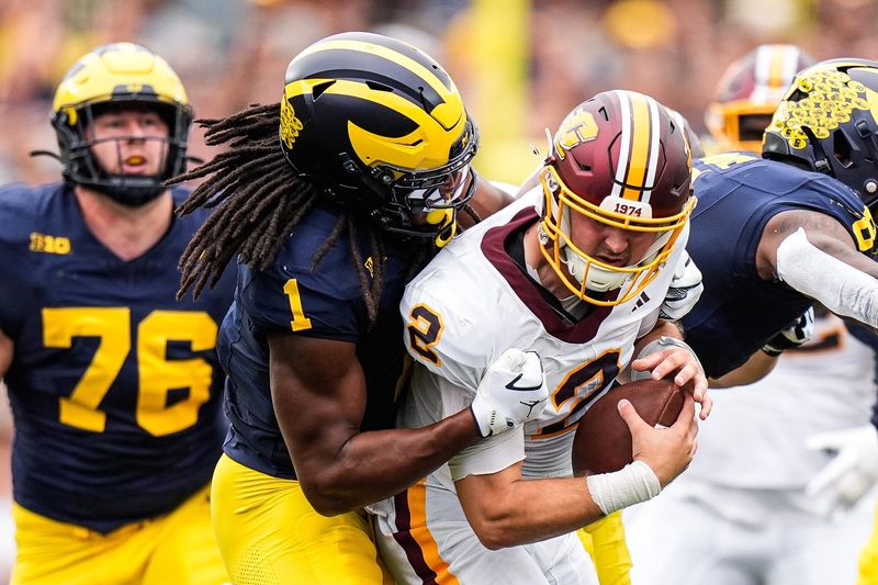 Michigan linebacker Jaishawn Barham (1) sacks Central Michigan quarterback Joe Labas (2) during the first half at Michigan Stadium in Ann Arbor on Saturday, Sept. 13, 2025.