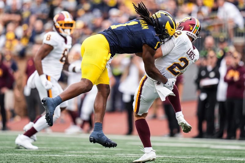 Michigan linebacker Jaishawn Barham (1) sacks Central Michigan quarterback Joe Labas (2)during the first half at Michigan Stadium in Ann Arbor on Saturday, Sept. 13, 2025.