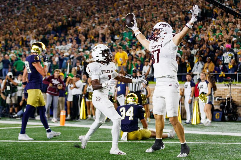 Texas A&M tight end Nate Boerkircher (87) celebrates after scoring a touchdown to tie the game in the second half of a NCAA football game against Notre Dame at Notre Dame Stadium on Saturday, Sept. 13, 2025, in South Bend. The extra point scored after this touchdown put Texas A&M ahead 41-40 to win the game.
