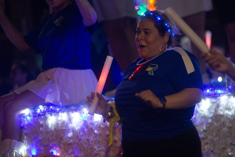 A Rally Credit Union marcher dances at the Buc Days Rally Night Parade on Leopard Street in Corpus Christi, Texas, on April 25, 2026.