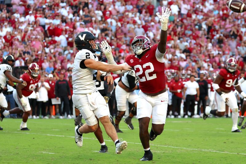 Oct 4, 2025; Tuscaloosa, Alabama, USA; Vanderbilt Commodores quarterback Diego Pavia (2) is pressured by Alabama Crimson Tide defensive lineman LT Overton (22) during the second half at Saban Field at Bryant-Denny Stadium. Mandatory Credit: David Leong-Imagn Images