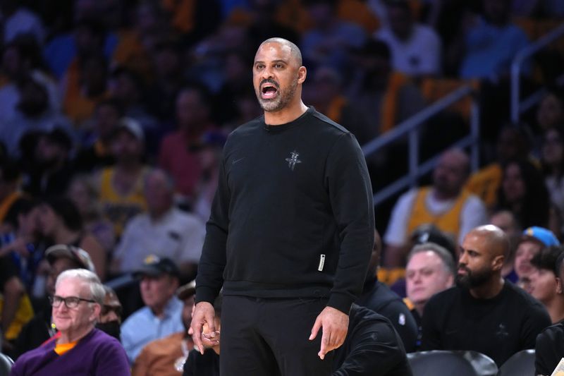 Apr 18, 2026; Los Angeles, California, USA; Houston Rockets head coach Ime Udoka watches in the first half against the Los Angeles Lakers during game one of the first round of the 2026 NBA Playoffs at Crypto.com Arena. Mandatory Credit: Kirby Lee-Imagn Images