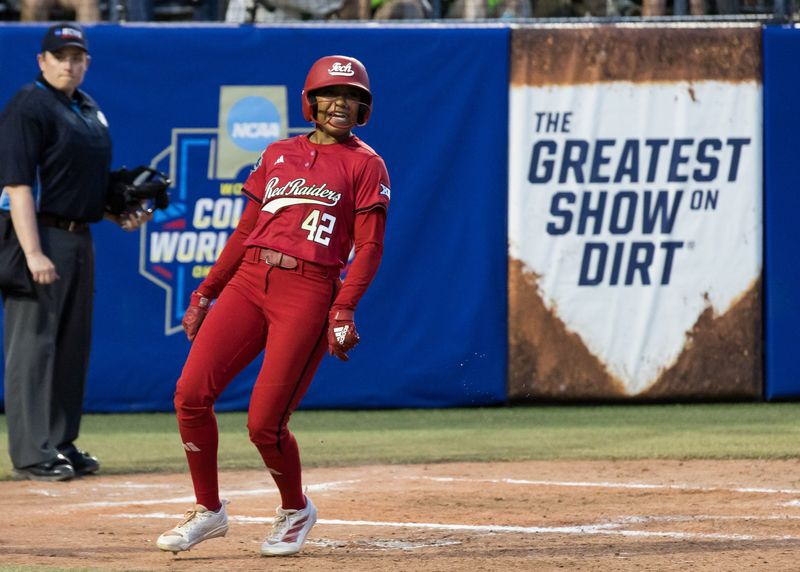 Jun 6, 2025; Oklahoma City, OK, USA; Texas Tech Red Raiders outfielder Mihyia Davis (42) yells after scoring a run in the fifth inning against the Texas Longhorns during game three of the NCAA Softball Women's College World Series finals at Devon Park. Mandatory Credit: Brett Rojo-Imagn Images