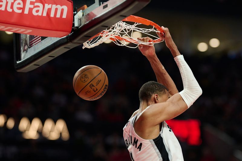 Apr 26, 2026; Portland, Oregon, USA; San Antonio Spurs forward Victor Wembanyama (1) reverse dunks the basketball during the second half against the Portland Trail Blazers during game four of the first round of the 2026 NBA Playoffs at Moda Center. Mandatory Credit: Troy Wayrynen-Imagn Images
