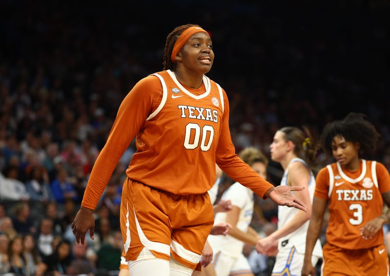 Apr 3, 2026; Phoenix, AZ, USA; Texas Longhorns center Kyla Oldacre (00) against the UCLA Bruins during a semifinal of the Final Four of the women's 2026 NCAA Tournament at Mortgage Matchup Center. Mandatory Credit: Mark J. Rebilas-Imagn Images
