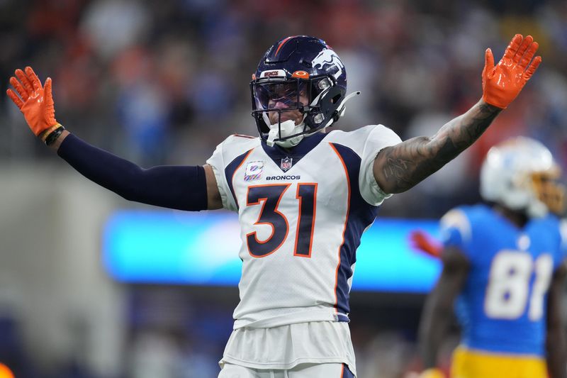 Oct 17, 2022; Inglewood, California, USA; Denver Broncos safety Justin Simmons (31) celebrates in the second half against the Los Angeles Chargers at SoFi Stadium. Mandatory Credit: Kirby Lee-USA TODAY Sports