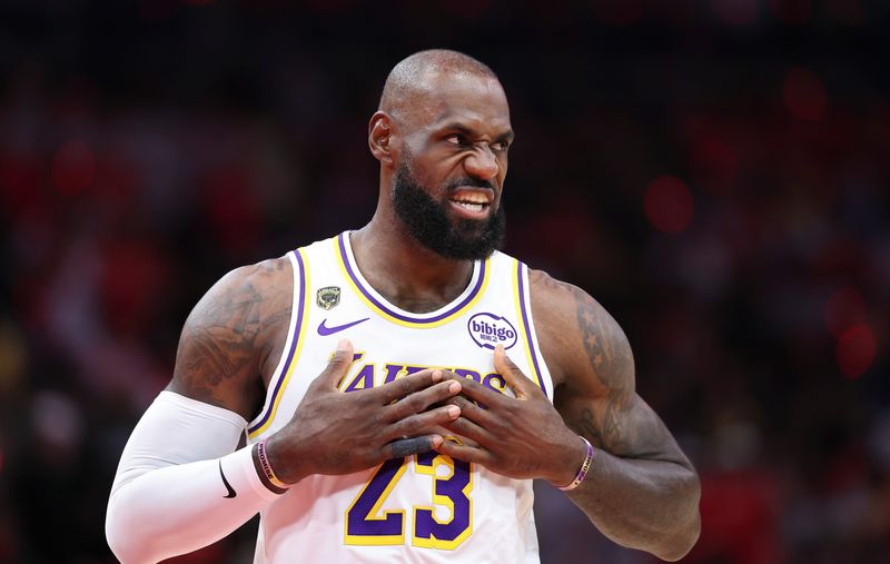 Los Angeles Lakers forward LeBron James walks on the court before the start of the game against the Houston Rockets in game four of the first round of the 2026 NBA Playoffs at Toyota Center.