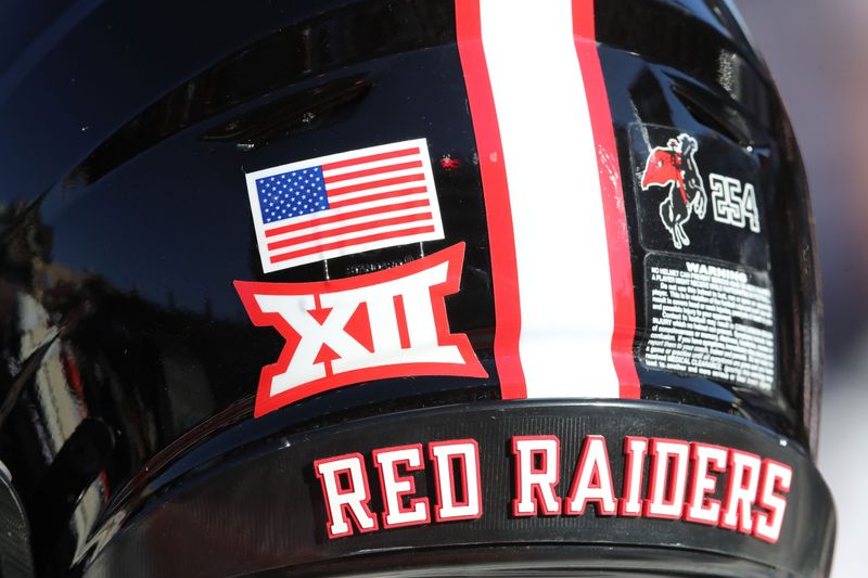 Nov 15, 2025; Lubbock, Texas, USA; A general view of a Texas Tech Red Raiders helmet on the bench in the first half of the game against the Central Florida Knights at Jones AT&T Stadium. Mandatory Credit: Michael C. Johnson-Imagn Images